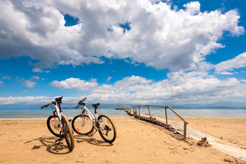 Fototapeta premium Two bicycles on the beach. Corfu island. Greece.