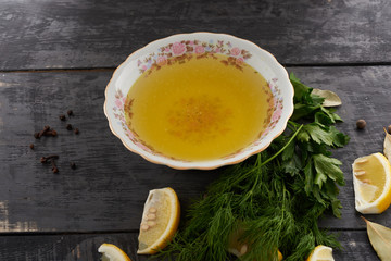 broth and seasonings in a dish on the table