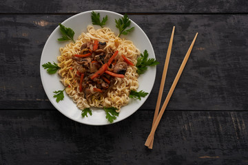 noodles on a plate and Chinese chopsticks top