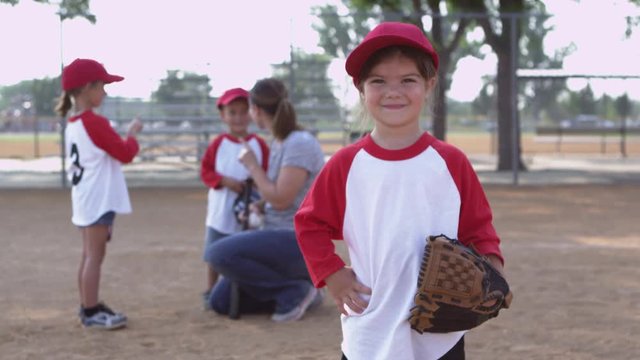 Portrait of little girl in little league