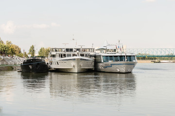 Fototapeta na wymiar Novi Sad, Serbia - Septembe 22, 2013: Passenger ships anchored in Novi Sad