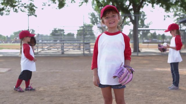 Portrait of little girl in little league