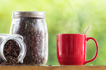 coffee mug wooden tabletop against grunge green blur background