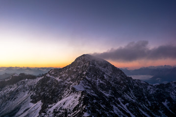Fototapeta na wymiar Sunrise on the Parpaner Rothorn mountain peak in the Alps - 1