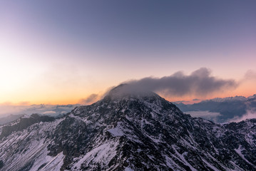 Fototapeta na wymiar Sunrise on the Parpaner Rothorn mountain peak in the Alps - 3