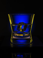 Drink in bar on color abstract background