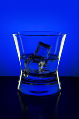 Drink in bar on color abstract background