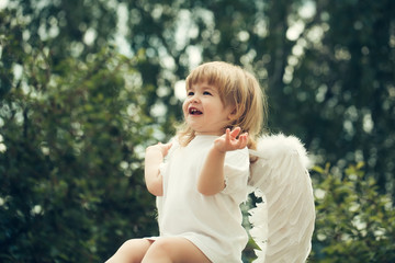 Little angel claps his hands