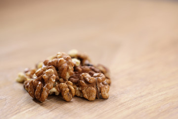 walnut kernels on aok wood table close up