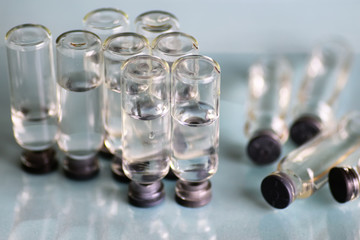 transparent vials of medicine