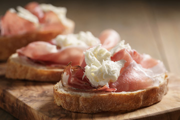 simple ciabatta slices with speck and mozzarella