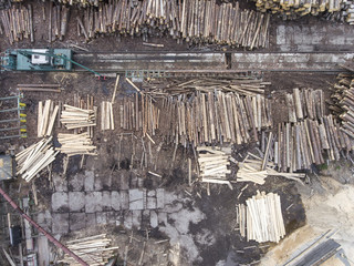 Sawmill. Felled trees, logs stacked in a pile. View from above.