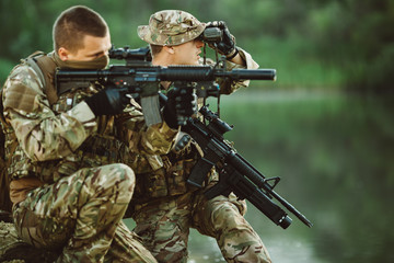 Special forces soldiers with weapon take part in military maneuv