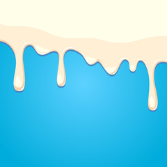 Dripping milk on blue background
