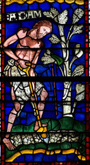 Adam working on the filed in stained glass