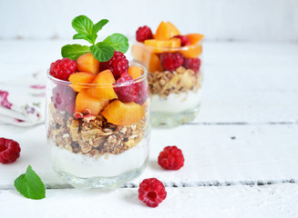 Homemade yogurt with granola apricots, peaches and raspberries o
