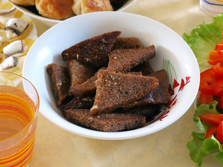 Rue bread slices fried in oil with salt and garlic       