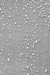 Water drop on grey background.