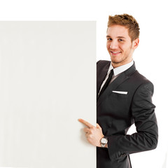 Handsome businessman showing a blank sign