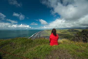 Fototapeta premium Woman is relaxing on the cliff