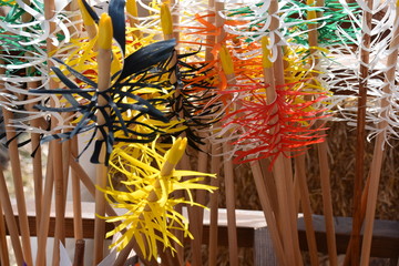 Traditional colorful Wooden Arrows vertically gathered together in a bowl. Colorful traditional arrows and arrowheads for archery