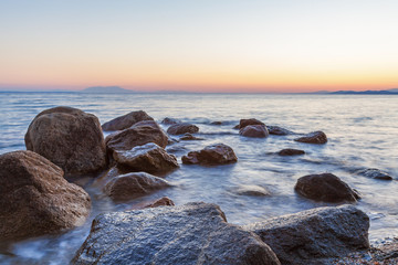 Landscape with Rocks and Waves at Sunset
