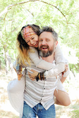 Fototapeta premium Boho style beautiful joyful couple, indie style, hipster outfit, bohemian outfit, woman embracing man