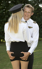 Airline officer with his hands on a female officer's backside