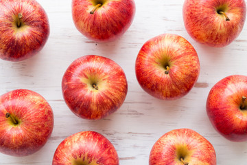 Red apple on rustic wooden table background