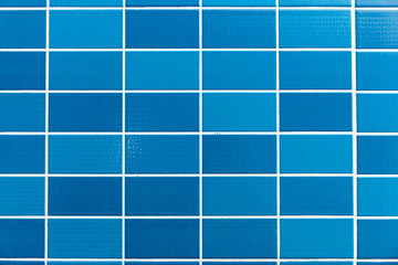 A blue tiled background with relatively small tiles