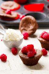 chocolate cake  with ice cream and raspberry.