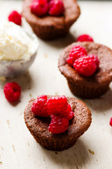 chocolate cake  with ice cream and raspberry.