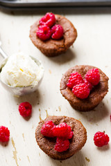 chocolate cake  with ice cream and raspberry.