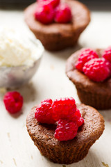 chocolate cake  with ice cream and raspberry.