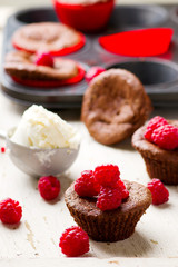 chocolate cake  with ice cream and raspberry.