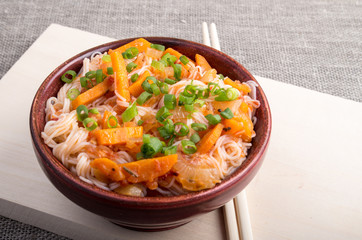 Asian food closeup of rice noodle in a wooden bowl