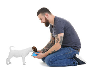 Handsome man with cute dog, isolated on white