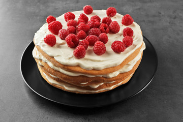 Tasty raspberry cake on grey background