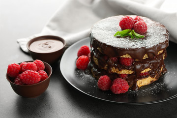 Tasty raspberry cake on grey background