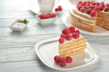 Slice of tasty raspberry cake on plate