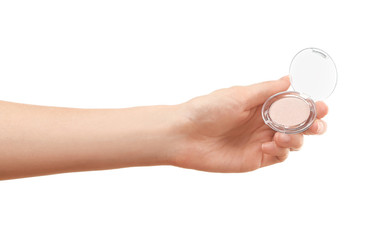 Female hand holding eye shadow, isolated on white