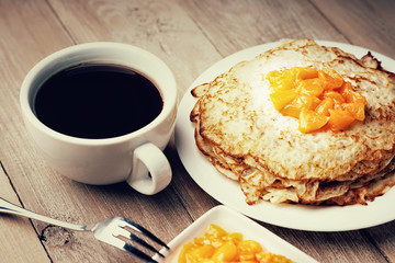 Pancakes with jam and coffee
