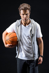 Skillful basketball player posing with confidence