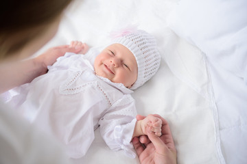 Mother holding her cute baby