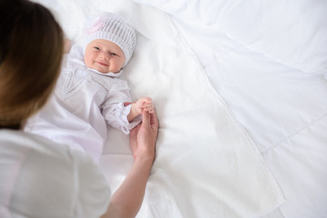 Mother holding her cute baby