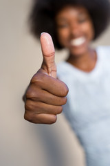 African American woman with thumbs up