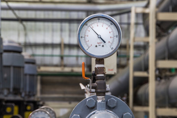 close up of industrial pipes and measurer of compression,gauge