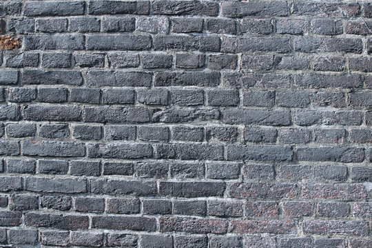 Texture Of A Black Burnt Brick Wall Covered With Soot