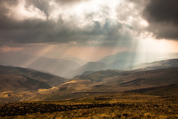 Fototapeta premium Sunbeams through the clouds