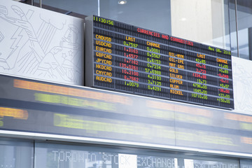 The currency exchange rates displayed at the Toronto Stock Exchange with stock ticker in blurred...